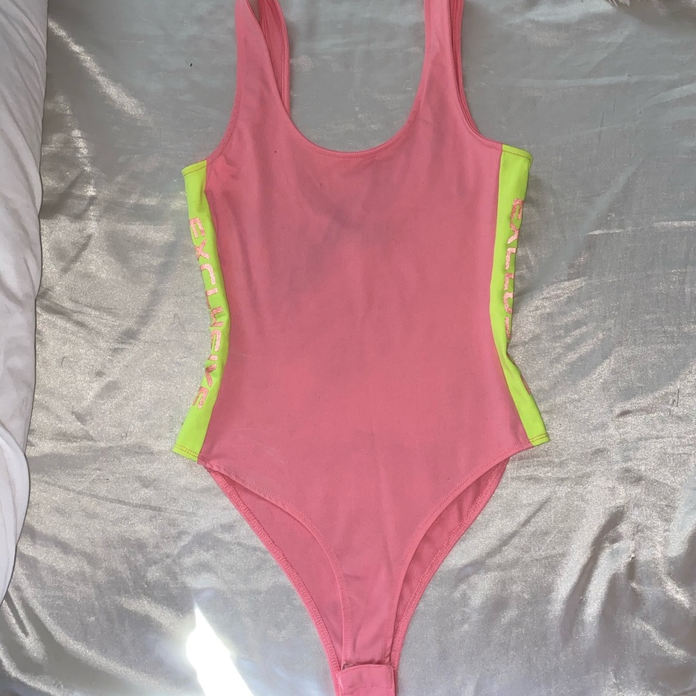 Pink and Neon green body suit